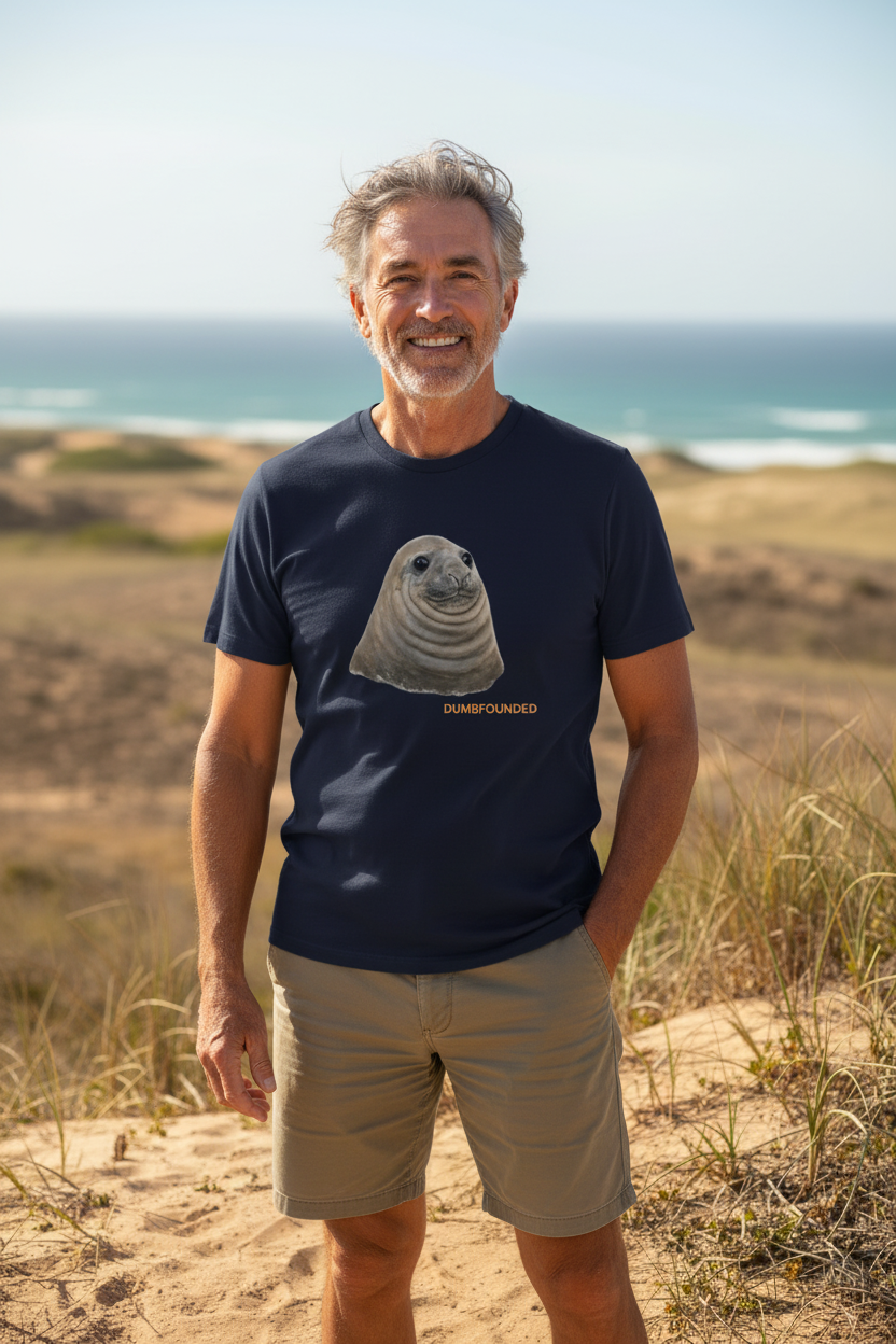 Neil the Seal Dumbfounded navy t-shirt lifestyle photo worn by a 65-year-old man outdoors